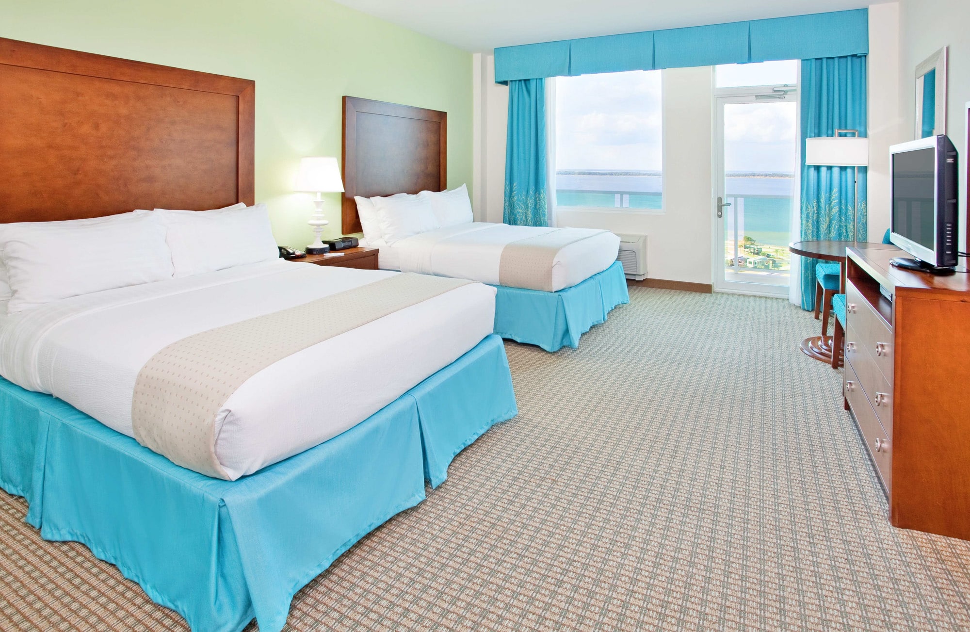 Holiday Inn Resort Pensacola Beach hotel room with a walk out balcony overlooking the ocean.