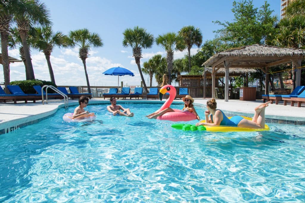 Friends in the pool at Surf & Sand Hotel.